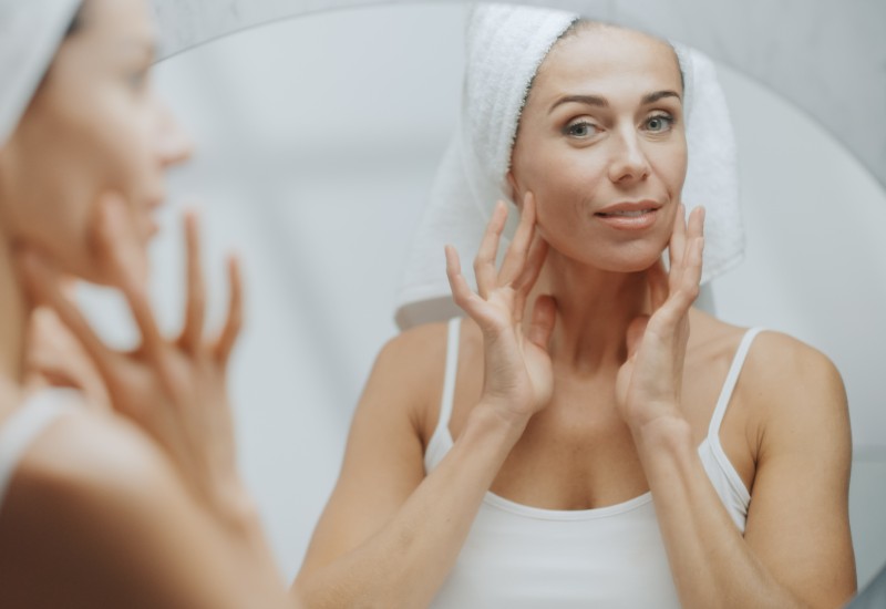 looking in the mirror after a facelift recovery