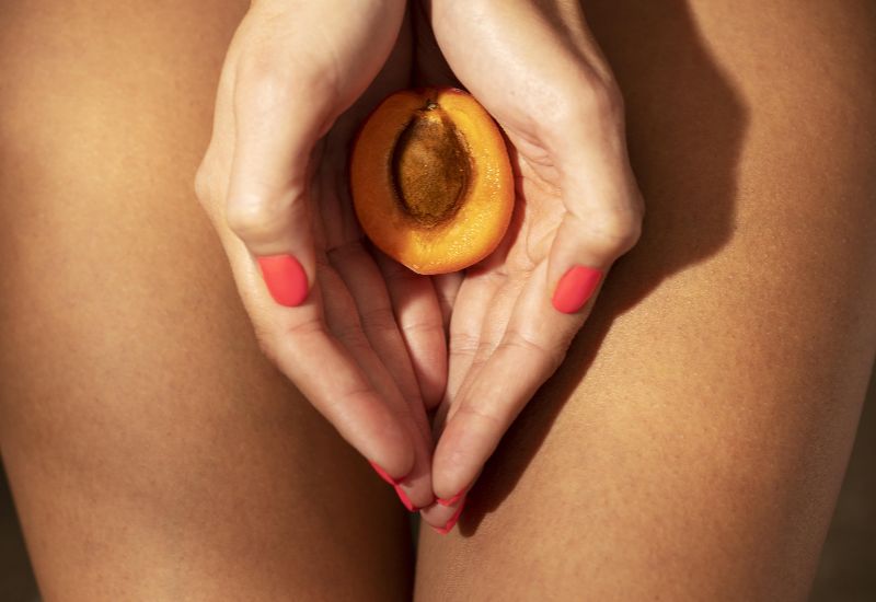 Symbolic image of labiaplasty concept with apricot