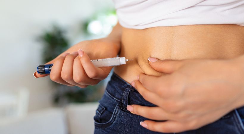 Someone using weight loss jabs