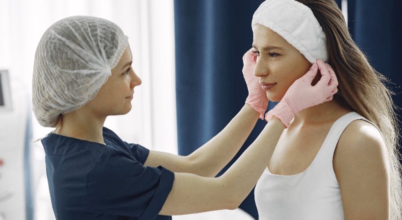 woman recovering from ear pinning surgery 