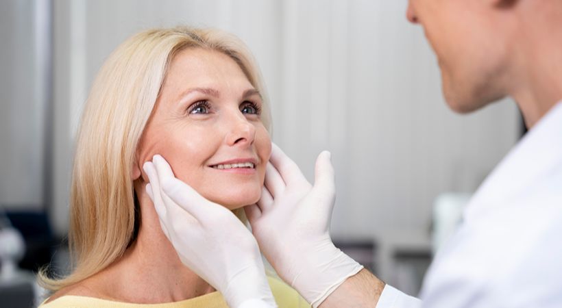 Woman having consultation for mini facelift 